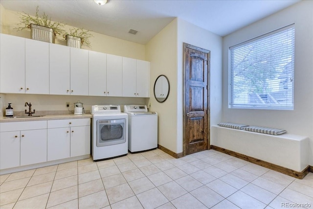 16713 W Archer Ave, Golden, CO 80401 - laundry room with cabinet space, separate washer and dryer, and baseboards