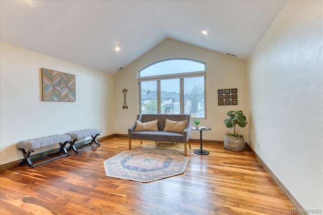 16713 W Archer Ave, Golden, CO 80401 - living room featuring wood finished floors, vaulted ceiling, baseboards, and recessed lighting
