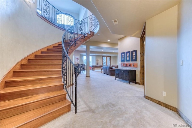 16713 W Archer Ave, Golden, CO 80401 - staircase featuring carpet, a high ceiling, and baseboards