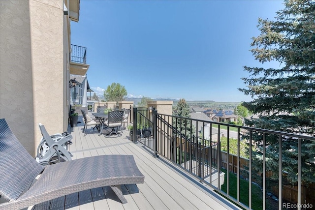 16713 W Archer Ave, Golden, CO 80401 - wooden terrace with outdoor dining area and a residential view