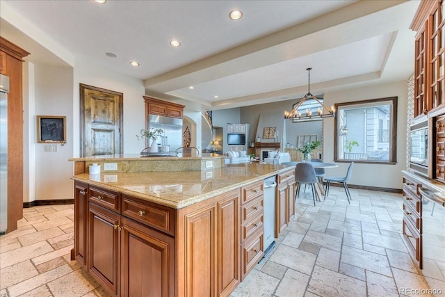 16713 W Archer Ave, Golden, CO 80401 - kitchen featuring baseboards, brown cabinets, recessed lighting, and stone tile floors