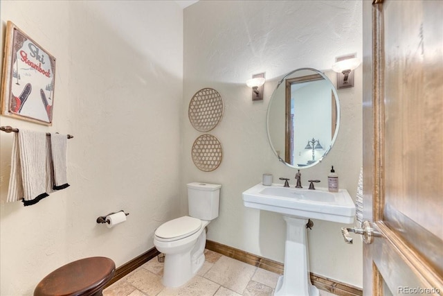 16713 W Archer Ave, Golden, CO 80401 - half bathroom featuring toilet and baseboards