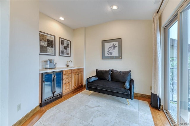 16713 W Archer Ave, Golden, CO 80401 - indoor wet bar with wine cooler, light wood-style floors, recessed lighting, and baseboards