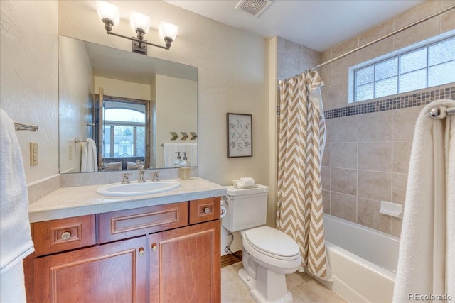 16713 W Archer Ave, Golden, CO 80401 - full bathroom featuring toilet, healthy amount of natural light, tile patterned floors, and vanity
