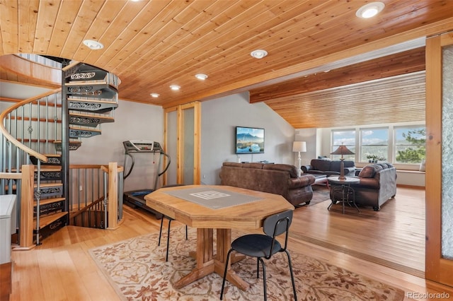 dining area with light hardwood / wood-style flooring and wood ceiling