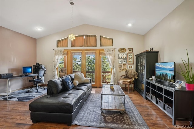 living room featuring hardwood / wood-style floors, french doors, and lofted ceiling