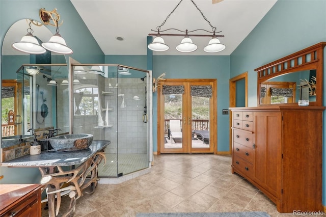 bathroom with tile flooring, an enclosed shower, and vanity