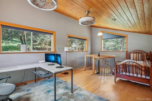 interior space with multiple windows, vaulted ceiling, hardwood / wood-style floors, and wooden ceiling