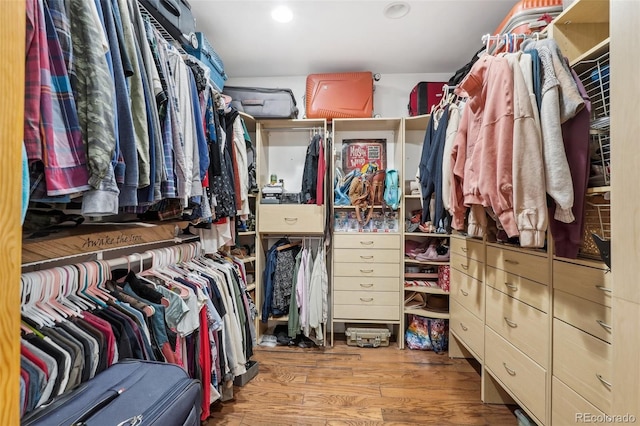 spacious closet featuring hardwood / wood-style floors