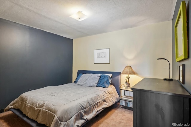 carpeted bedroom featuring a textured ceiling