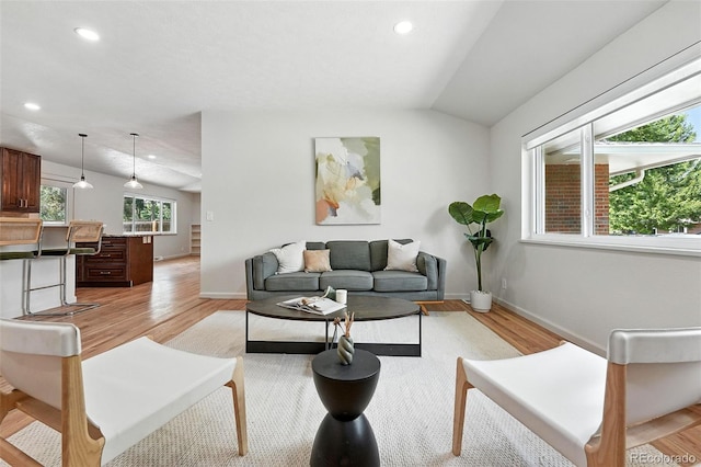 7035 S Gray Ct, Littleton, CO 80128 - living area featuring light wood-style floors, recessed lighting, and vaulted ceiling