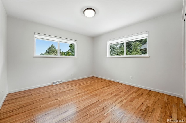 7035 S Gray Ct, Littleton, CO 80128 - spare room with light wood finished floors and baseboards