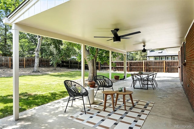 7035 S Gray Ct, Littleton, CO 80128 - fenced backyard with ceiling fan and a patio area