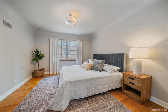 2065 Leyden St, Denver, CO 80207 - bedroom featuring light wood finished floors and baseboards