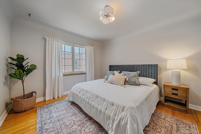 2065 Leyden St, Denver, CO 80207 - bedroom featuring baseboards and light wood-type flooring