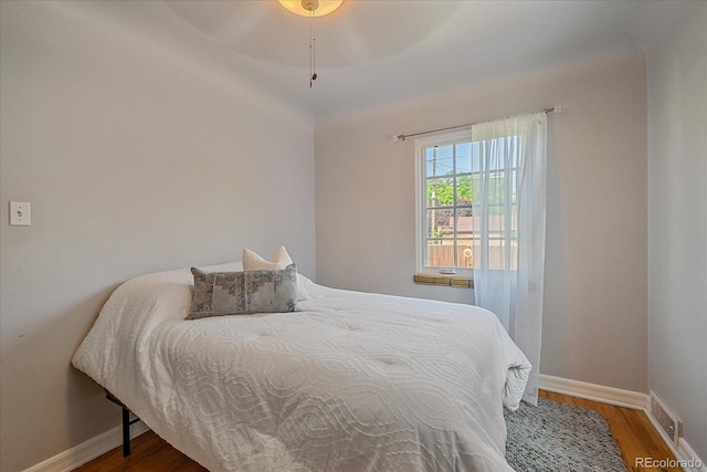 2065 Leyden St, Denver, CO 80207 - bedroom with wood finished floors and baseboards