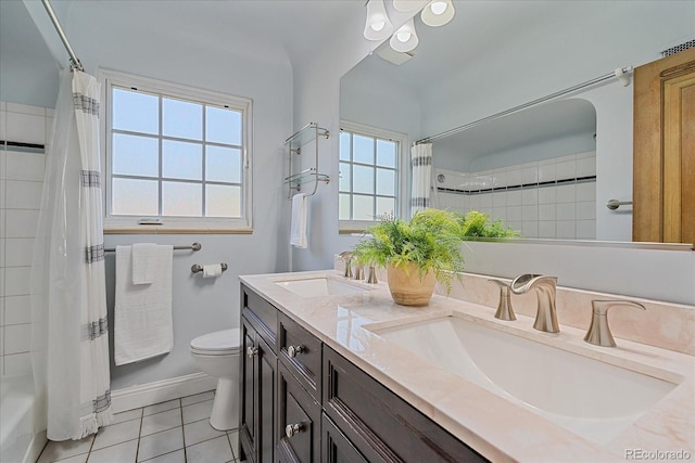2065 Leyden St, Denver, CO 80207 - bathroom with tile patterned flooring, double vanity, toilet, shower / bath combo with shower curtain, and baseboards
