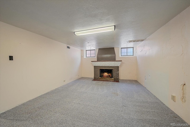 2065 Leyden St, Denver, CO 80207 - below grade area with a fireplace, carpet flooring, and a textured ceiling