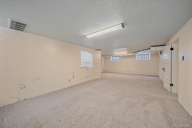 2065 Leyden St, Denver, CO 80207 - basement featuring carpet flooring and a textured ceiling