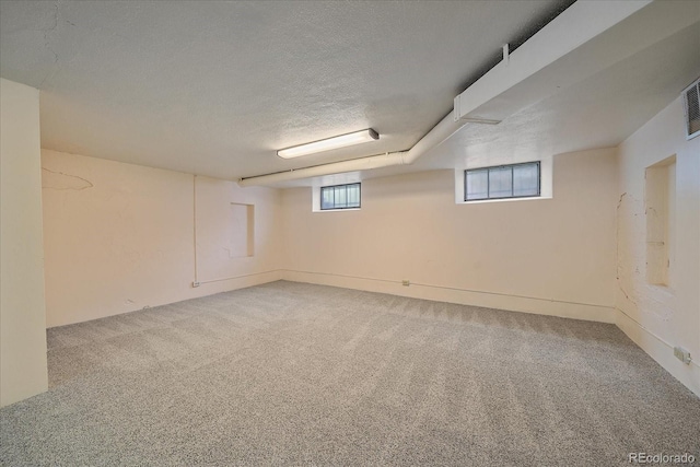 2065 Leyden St, Denver, CO 80207 - basement featuring carpet and a textured ceiling