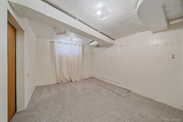 2065 Leyden St, Denver, CO 80207 - finished basement featuring carpet, a textured ceiling, and baseboards