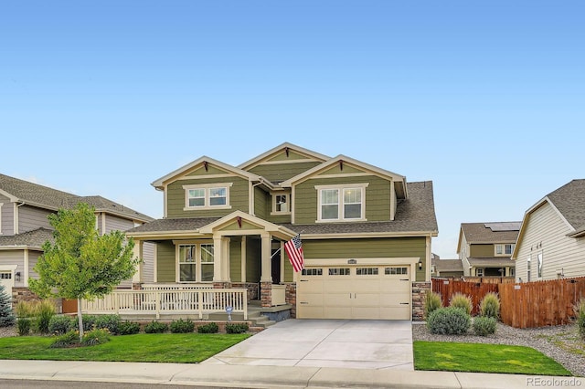16043 Fillmore St, Thornton, CO 80602 - craftsman house featuring covered porch, concrete driveway, an attached garage, stone siding, and a shingled roof