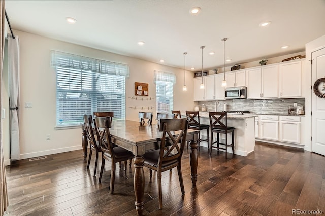 16043 Fillmore St, Thornton, CO 80602 - dining room with dark wood-style flooring and recessed lighting