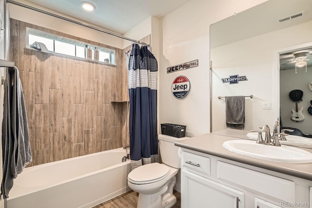 16043 Fillmore St, Thornton, CO 80602 - full bath featuring vanity, shower / bath combo, a ceiling fan, and wood finished floors
