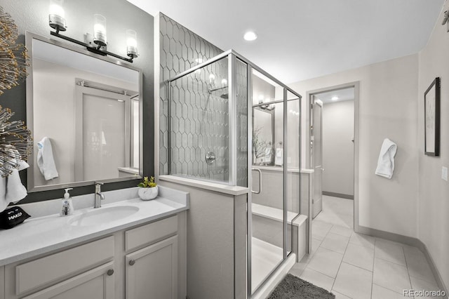 bathroom featuring vanity, tile patterned floors, and a shower with door