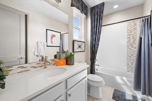 full bathroom with tile patterned flooring, vanity, toilet, and shower / tub combo