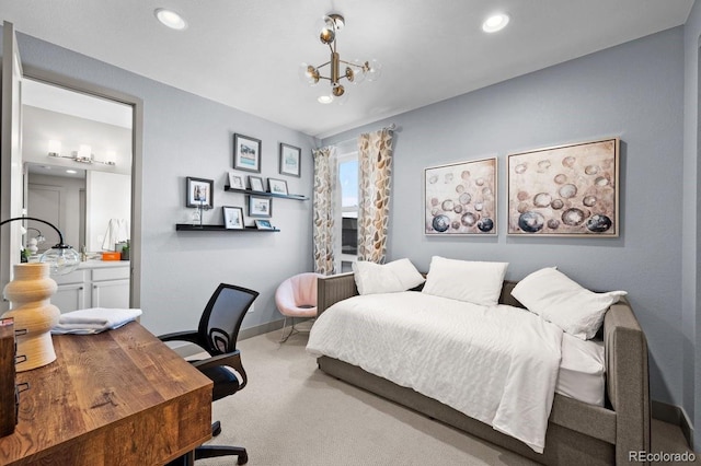 carpeted bedroom featuring a chandelier