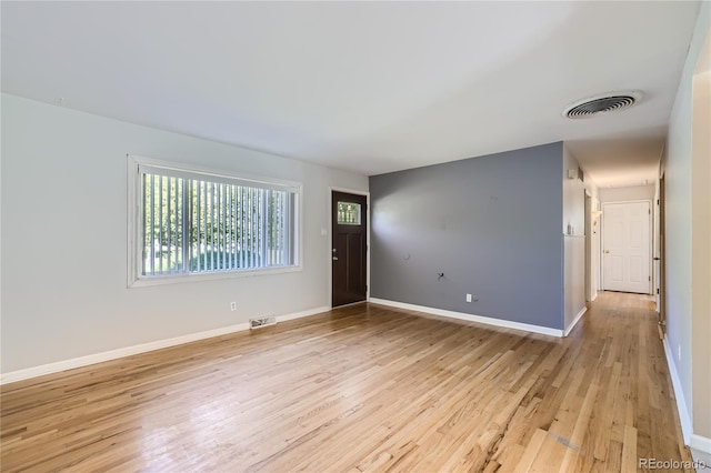 unfurnished room featuring light hardwood / wood-style floors