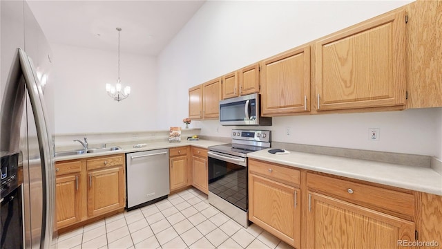 kitchen with sink, light tile patterned flooring, hanging light fixtures, stainless steel appliances, and a notable chandelier