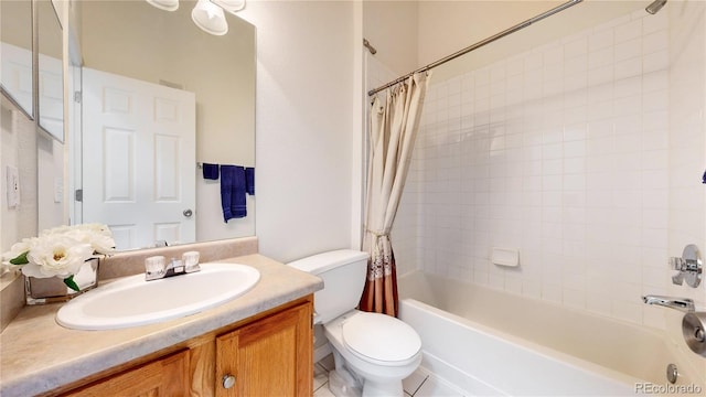 full bathroom featuring vanity, shower / tub combo with curtain, toilet, and tile patterned floors