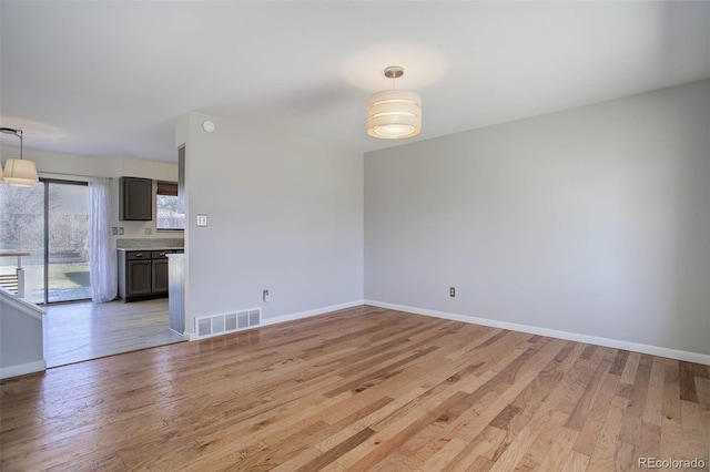 unfurnished living room with light wood-type flooring