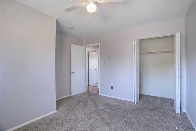 unfurnished bedroom with ceiling fan, carpet floors, and a closet