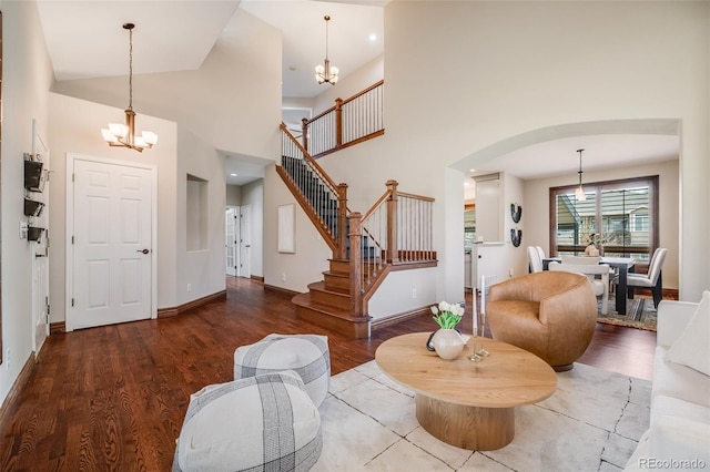 17522 E Dewberry Dr, Parker, CO 80134 - foyer with a chandelier, baseboards, wood finished floors, stairs, and a towering ceiling