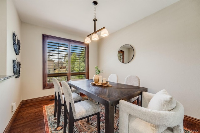 17522 E Dewberry Dr, Parker, CO 80134 - dining space featuring dark wood-style floors and baseboards