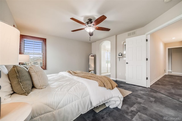 17522 E Dewberry Dr, Parker, CO 80134 - bedroom featuring arched walkways, a ceiling fan, ensuite bathroom, and baseboards