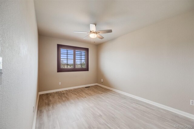 17522 E Dewberry Dr, Parker, CO 80134 - empty room with light wood finished floors, ceiling fan, and baseboards
