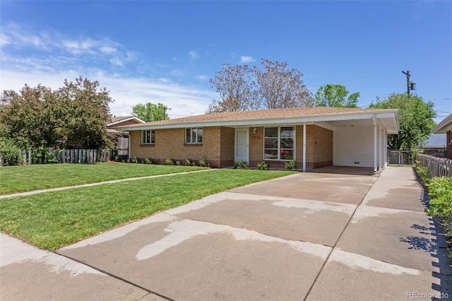 4728 Dover St, Wheat Ridge, CO 80033 - single story home featuring concrete driveway, brick siding, and an attached carport