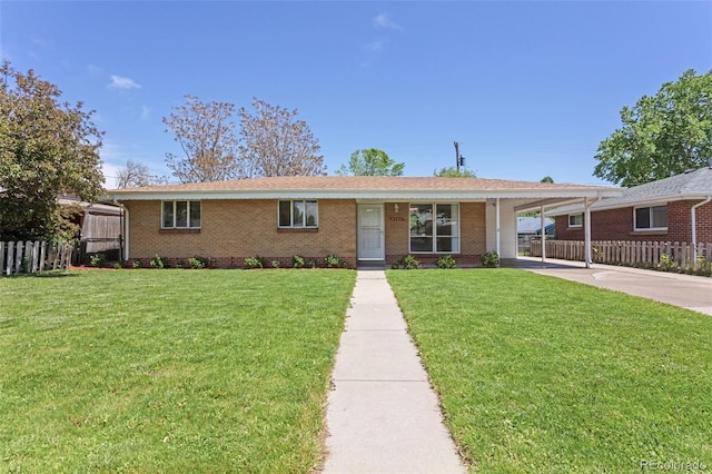 4728 Dover St, Wheat Ridge, CO 80033 - ranch-style house with brick siding, concrete driveway, and a carport