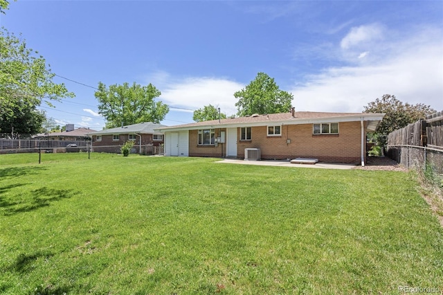 4728 Dover St, Wheat Ridge, CO 80033 - back of house with brick siding, a fenced backyard, and a patio