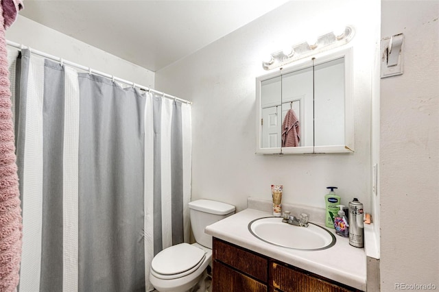 bathroom with toilet and vanity