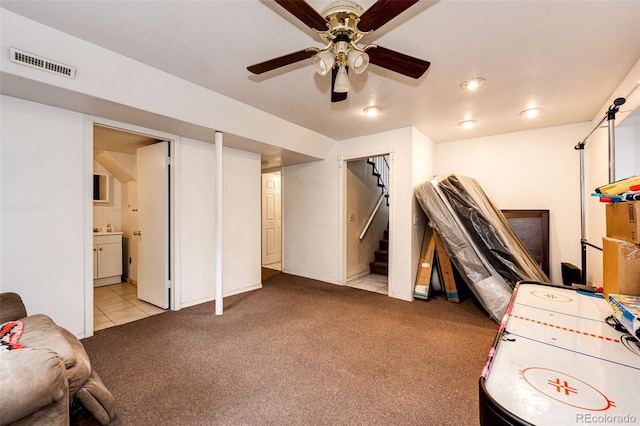 playroom featuring light colored carpet and ceiling fan