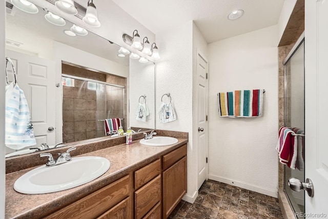 bathroom with vanity and an enclosed shower