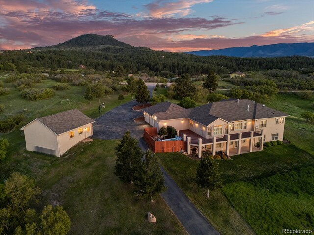 3485 Park Ridge Rd, Sedalia, CO 80135 - view from above of property with a forest and mountains