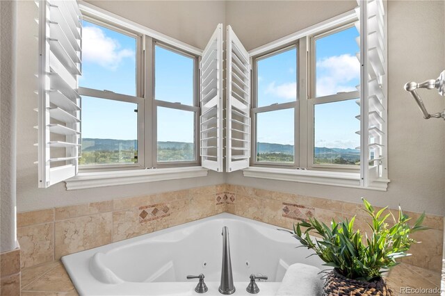 3485 Park Ridge Rd, Sedalia, CO 80135 - full bathroom featuring healthy amount of natural light and a tub with jets