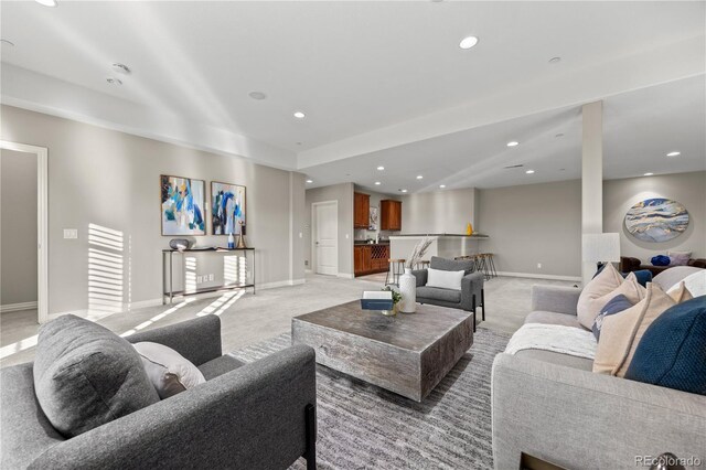 3485 Park Ridge Rd, Sedalia, CO 80135 - living area featuring light colored carpet, baseboards, and recessed lighting
