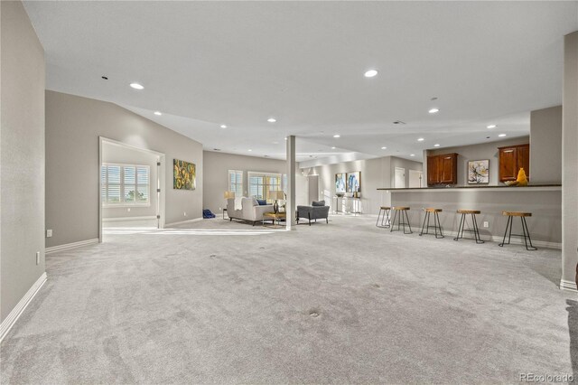 3485 Park Ridge Rd, Sedalia, CO 80135 - living area featuring recessed lighting, light colored carpet, and baseboards